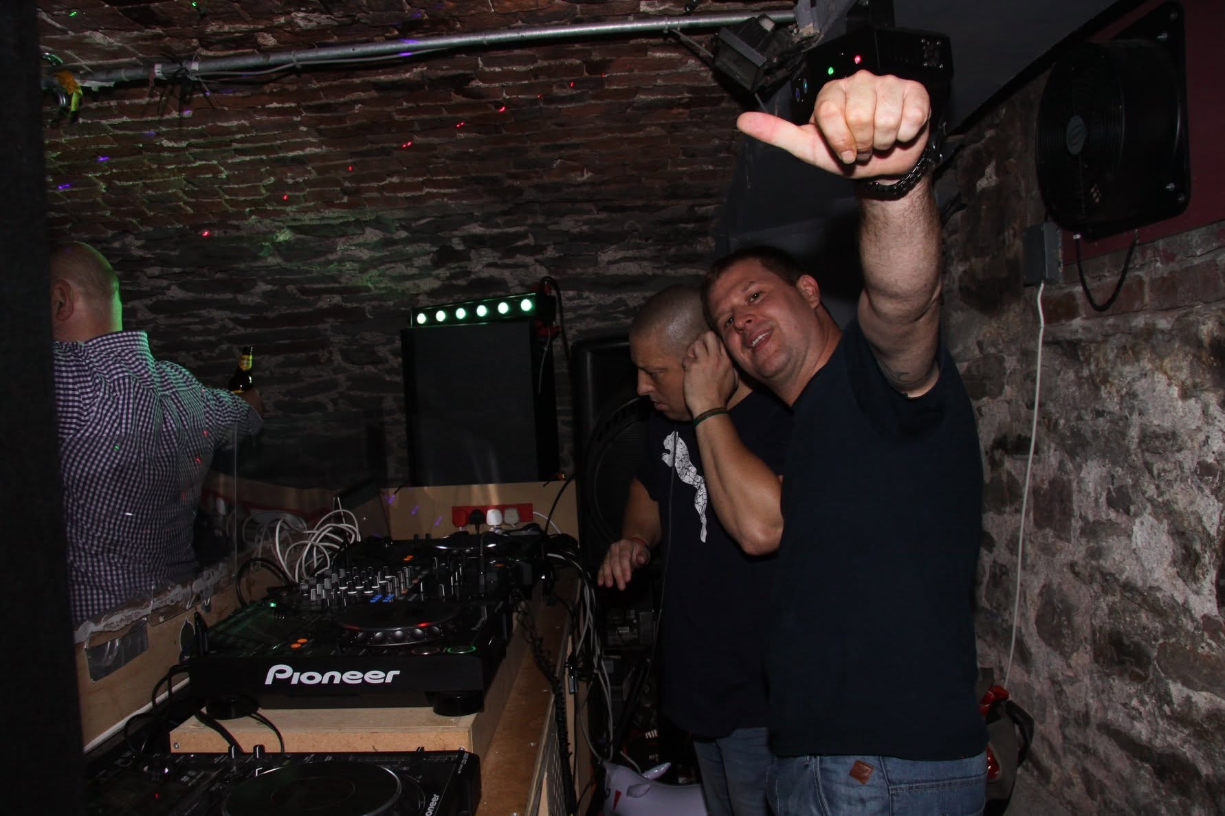 Friends at a Trancelation night under brick ceiling